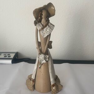 Venezuela made   Tan and White Sculpture of woman holding flowers